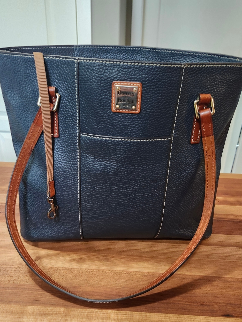 Dooney & Bourke "Lexington" Navy Leather Tote with Tan Trim.